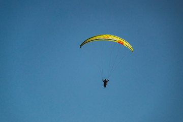 Parachutist Jumper in the blue sky