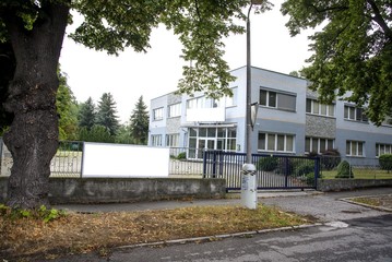 Building with the blank sign for company name.