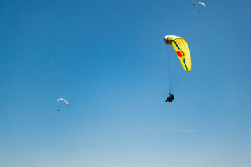 Parachutist Jumper in the blue sky