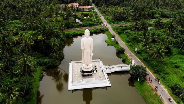 Aerial view from shot Peraliya Buddha Statue, the Tsunami Memorial in Hikkaduwa, Sri Lanka 4k
