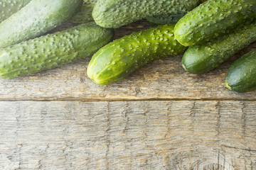 Fresh cucumbers on a wooden table. Rendered image, Copy space. Copy space