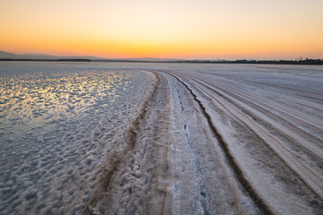 Salty path to the sun - A sunset at the salt lake