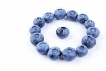 Blueberries on white background, blueberry berries isolated, blue berries close-up, blank for designer, vegetarian food for breakfast