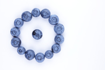 Blueberries on white background, blueberry berries isolated, blue berries close-up, blank for designer, vegetarian food for breakfast