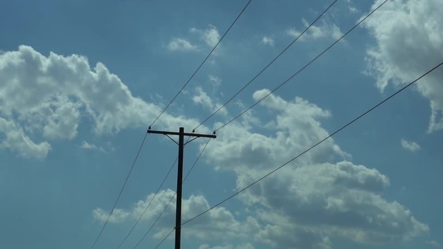 Telephone lines on a cloudy day, moving background