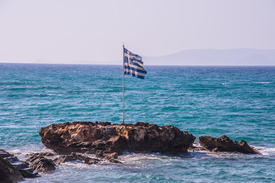 Greek flag in front of the Mediterranean Sea - Crete