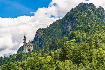 Schwangau, Germany June 10, 2018: Famous Neuschwanstein Castle with scenic mountain landscape near 