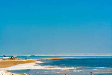 Lowest salty lake in world below sea level Dead sea, full of minerals near luxury vacation resort Ein Bokek, perfect place for medical treatments,