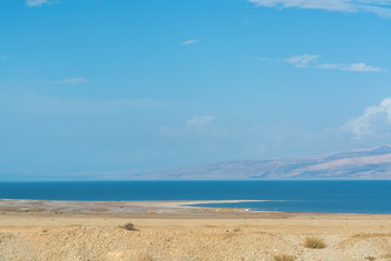 Lowest salty lake in world below sea level Dead sea, full of minerals near luxury vacation resort Ein Bokek, perfect place for medical treatments, climatotherapy, thalassotherapy and heliotherapy.