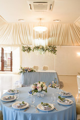 Beautiful table layout for guests at a wedding. A decoration of the table