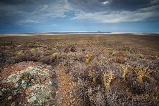 Panoramic views over the Tankwa Karoo Desert with dramatic thunderclouds in the sky