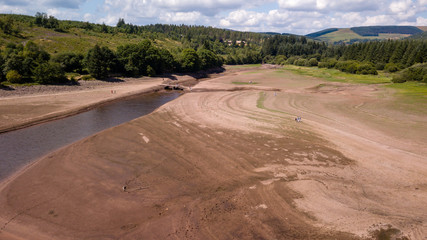 Aerial drone view of a dried up reservoir during a heatwave in summer