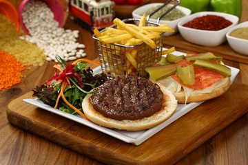 Open burger with lettuce leaves