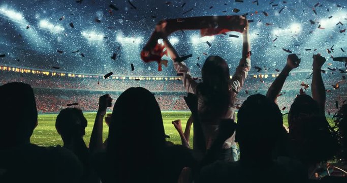 Fans celebrating the success of their favorite sports team on the stands of the professional stadium while it's snowing. Stadium is made in 3D and animated.