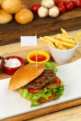 Fresh tasty burger with french fries and sauce