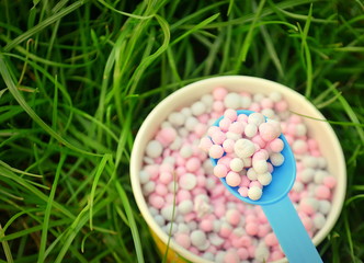 New nano ice cream in a glass on the green grass.