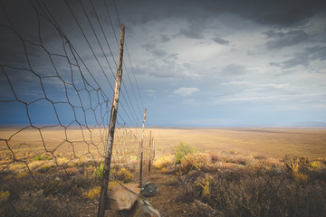 Panoramic views over the Tankwa Karoo Desert with dramatic thunderclouds in the sky