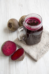 Beetroot smoothie in glass jar, side view. Close-up.