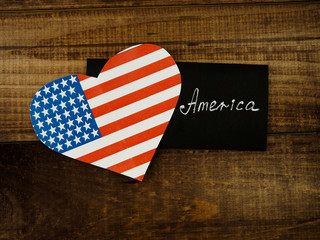 Flag of United States of America on heart shape with old vintage paper background, with clipping...