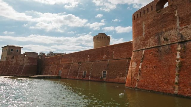 POV journey through the moats of Livorno, Tuscany, Italy featuring the prominent Old Fortress or Fortezza Vecchia. Points of interest include the Old Fortress and Venezia District