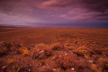 Panoramic views over the Tankwa Karoo Desert with dramatic thunderclouds in the sky
