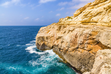 Wied iz Zurrieq, Malta. Picturesque golden rocks above the water