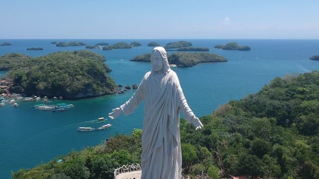 Orbiting Jesus Christ's statue in Hundred Islands National Park in Alaminos City, Pangasinan, Philippines.