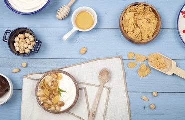 a bowl of yoghurt  over wooden table