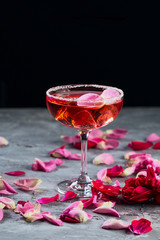 Rose cocktail. On grey stone concrete background. Copy space