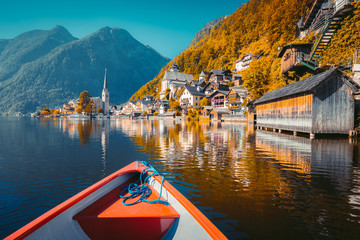 Hallstatt lakeside town with boat in Teal and Orange look, Austria
