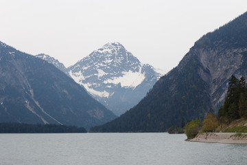 Fototapeta premium Majestic emerald mountain lake in Switzerland on the background of the Alps