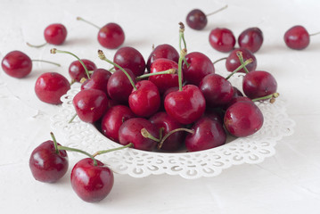 ripe cherries on white board painted with chalk