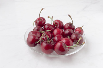 bunch ripe cherries on white marble