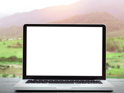 Laptop Computer With Blank White Screen On Table,nature Background.