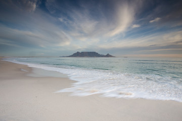 Fototapeta na wymiar Stunning clouds over Table Mountain in Cape Town South Africa,as seen from blouberg beach, one of the top holiday destinations in the world