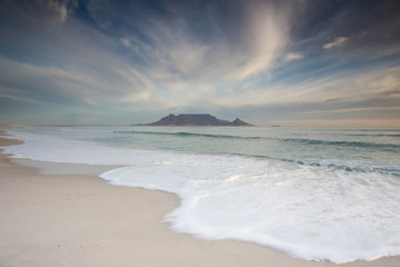 Stunning clouds over Table Mountain in Cape Town South Africa,as seen from blouberg beach, one of the top holiday destinations in the world