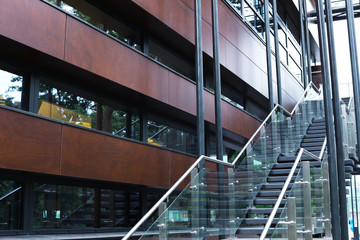 Wall of beautiful modern building with windows and stairs