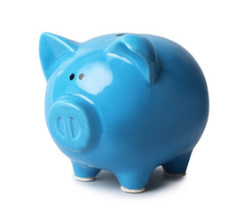 Blue piggy bank on gray background. Money saving