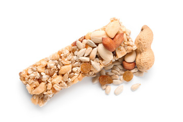 Grain cereal bar and nuts on white background. Healthy snack