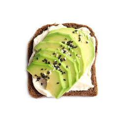 Toast bread with cream cheese and avocado slices on white background