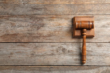 Judge's gavel on wooden background, top view. Law concept