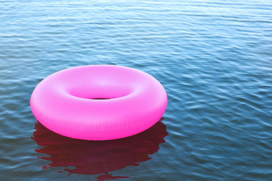 Inflatable ring floating on sea water. Summer vacation