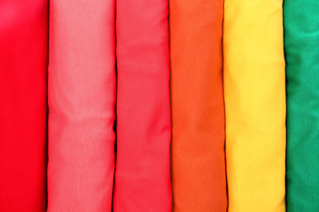 Fototapeta na wymiar Many trendy colorful t-shirts, close up view