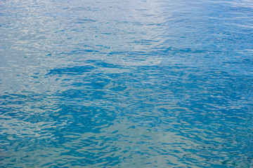 blue water surface nature background texture concept of sea with small waves and empty space for copy or text