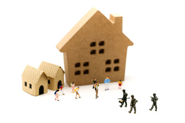 Miniature people : Soldier go home after mission complete with children and family,coming home concept.