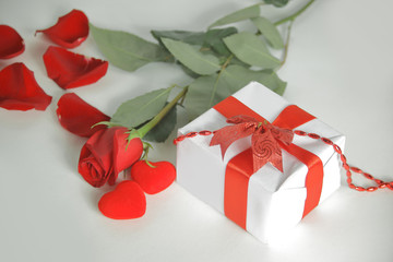 close up.gift box and red rose on a white background.concept of love