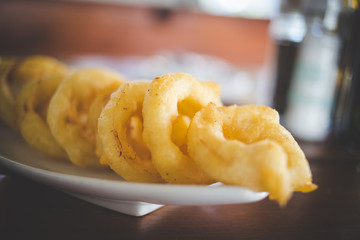 Close up image of delicious onion rings in a gourmet restaurant