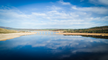 Aerial image over a very dry Theewaterskloof dam during the worst drought in decades in the Western Cape of South Africa with massive patches of barren earth exposed