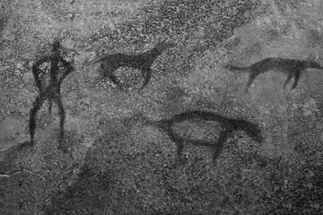 An image of ancient animals and a man on a cave wall. ancient history, archeology.