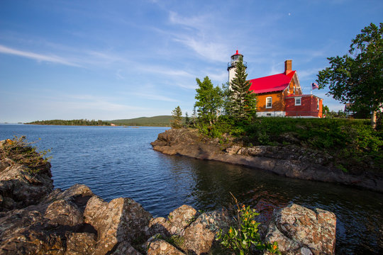 Lighthouse On A Rocky Coast. The Eagle Harbor Lighthouse on the rocky shore of Lake Superior. Eagle Harbor, Upper Peninsula, Michigan, USA.